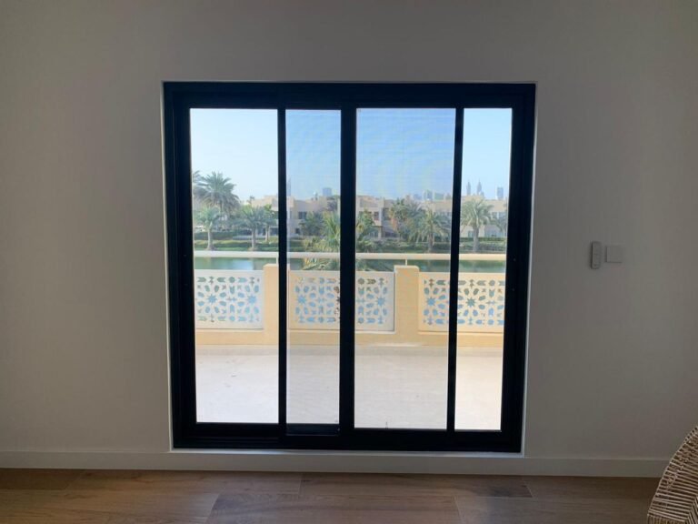 Black aluminium sliding door with fly screen
