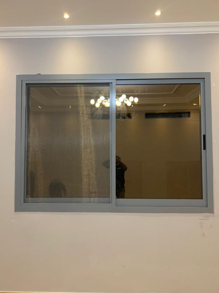 Grey aluminium sliding window with fly screen